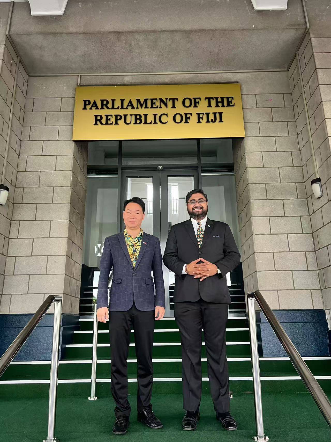 Ketan Lal with Huang Ruitian on the steps of Fiji’s Parliament